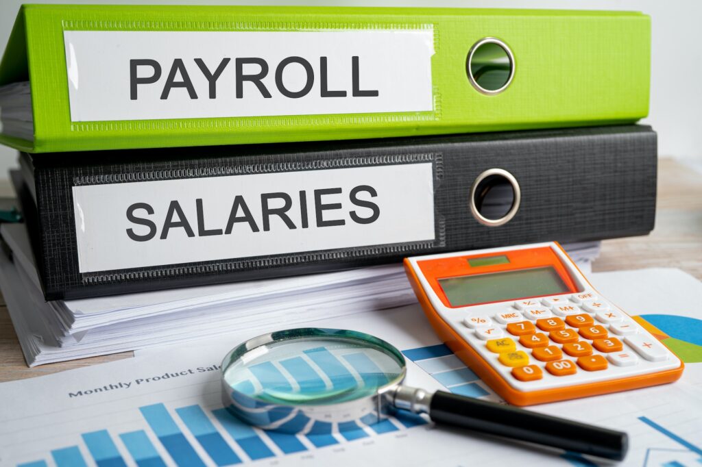 Payroll, Salaries. Binder data finance report business with graph analysis in office.