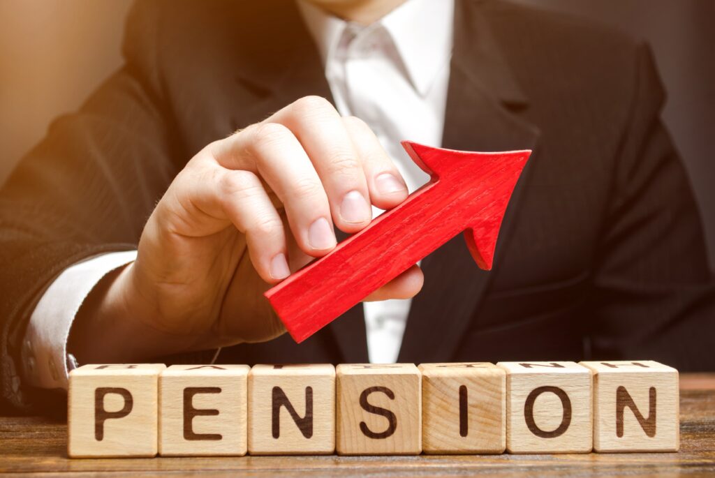 Wooden blocks with the word Pension and up arrow