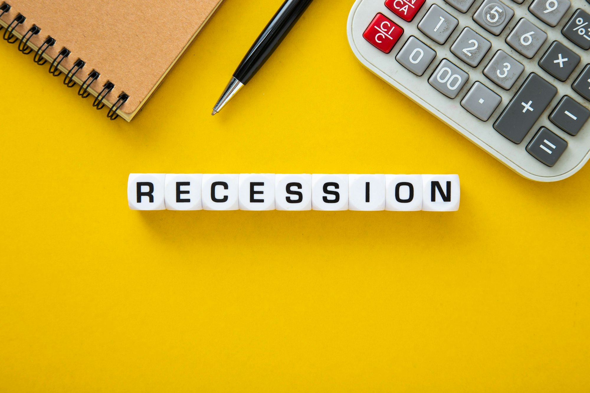 Recession word on yellow background.